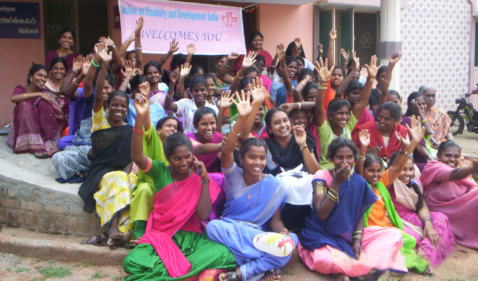 A group of women cheering together after a workshop